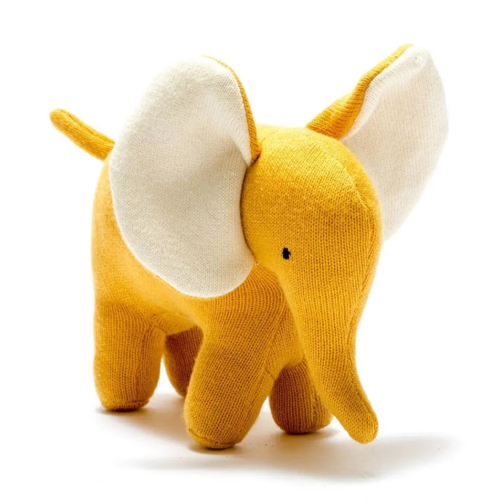 A Best Years knitted organic elephant plush toy in mustard yellow with large off-white ears, photographed on a clean white background.