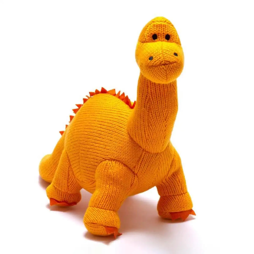 Best Years knitted dinosaur toy in orange on a white background