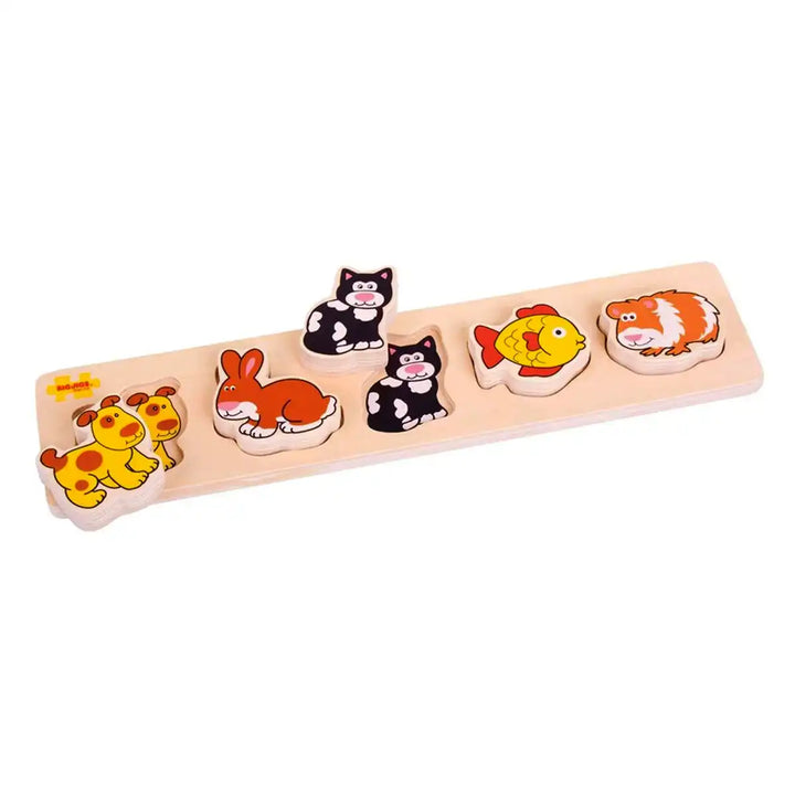 Bigjigs Toys chunky wooden puzzle with pet animal figures on a white background