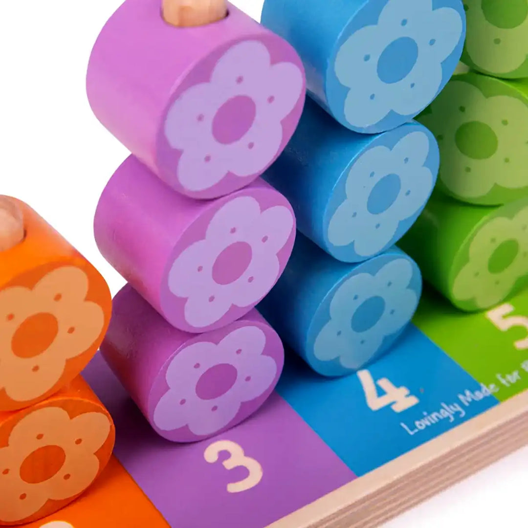Bigjigs Toys colourful wooden first flower stacker with numbered steps and flower-shaped blocks on a white background