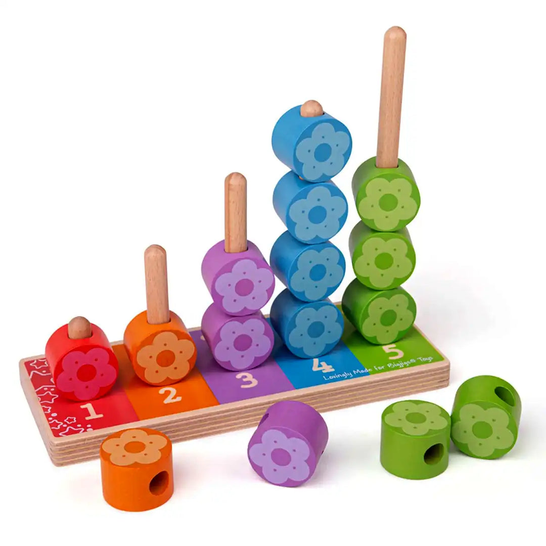 Bigjigs Toys colourful wooden first flower stacker with numbered steps and flower-shaped blocks on a white background