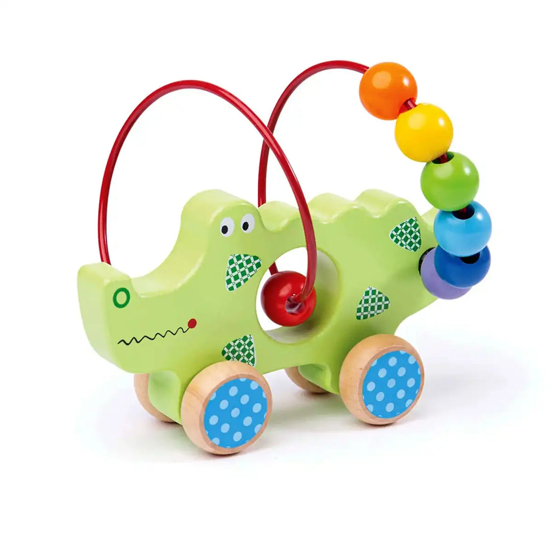 Bigjigs Toys children's push along green crocodile with colourful beads on a white background