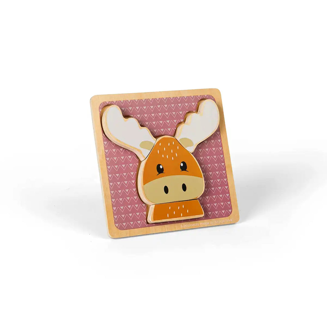 Bigjigs Toys children's wooden puzzle of a reindeer face on a pink background