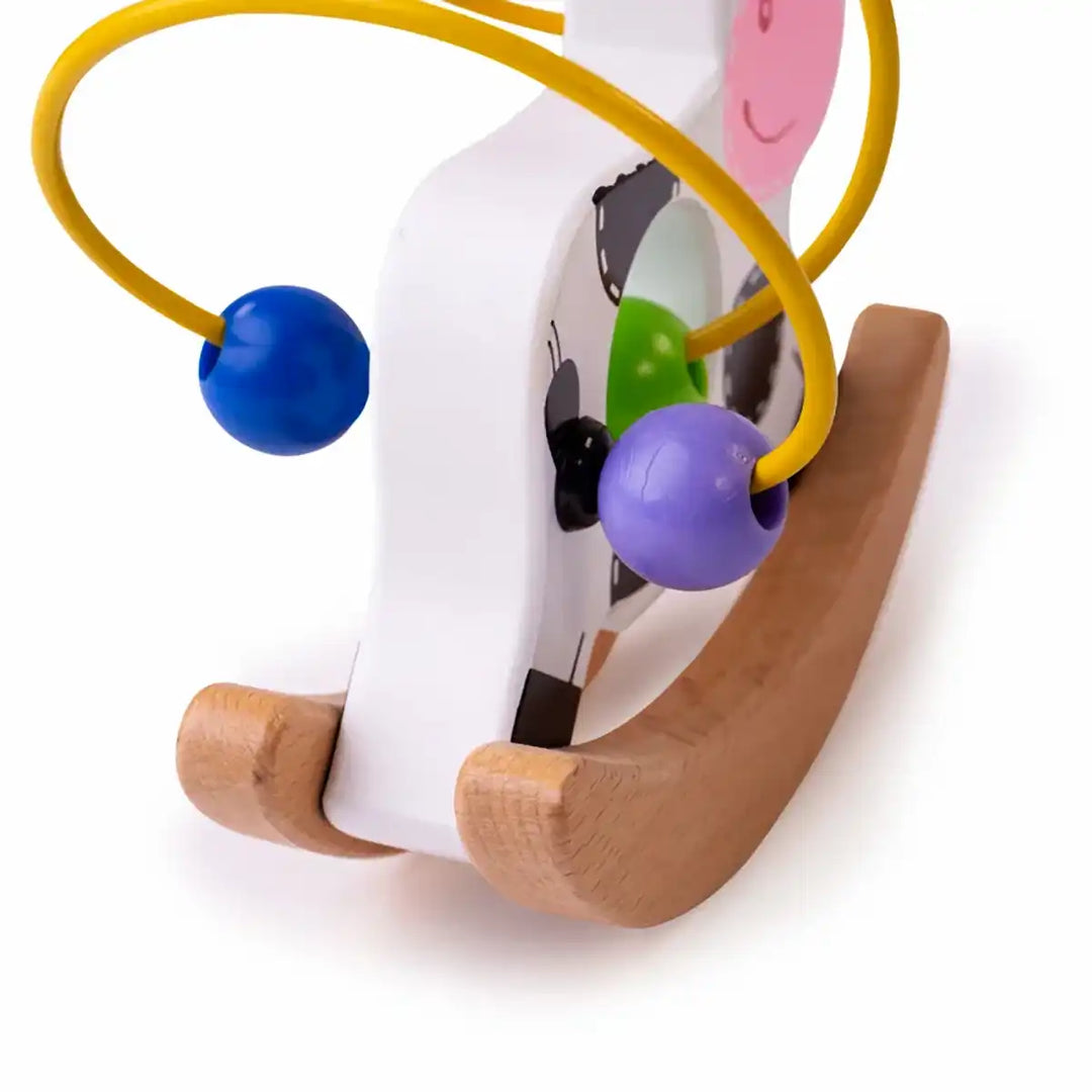 Bigjigs Toys wooden rocking cow bead frame with colourful beads on a white background