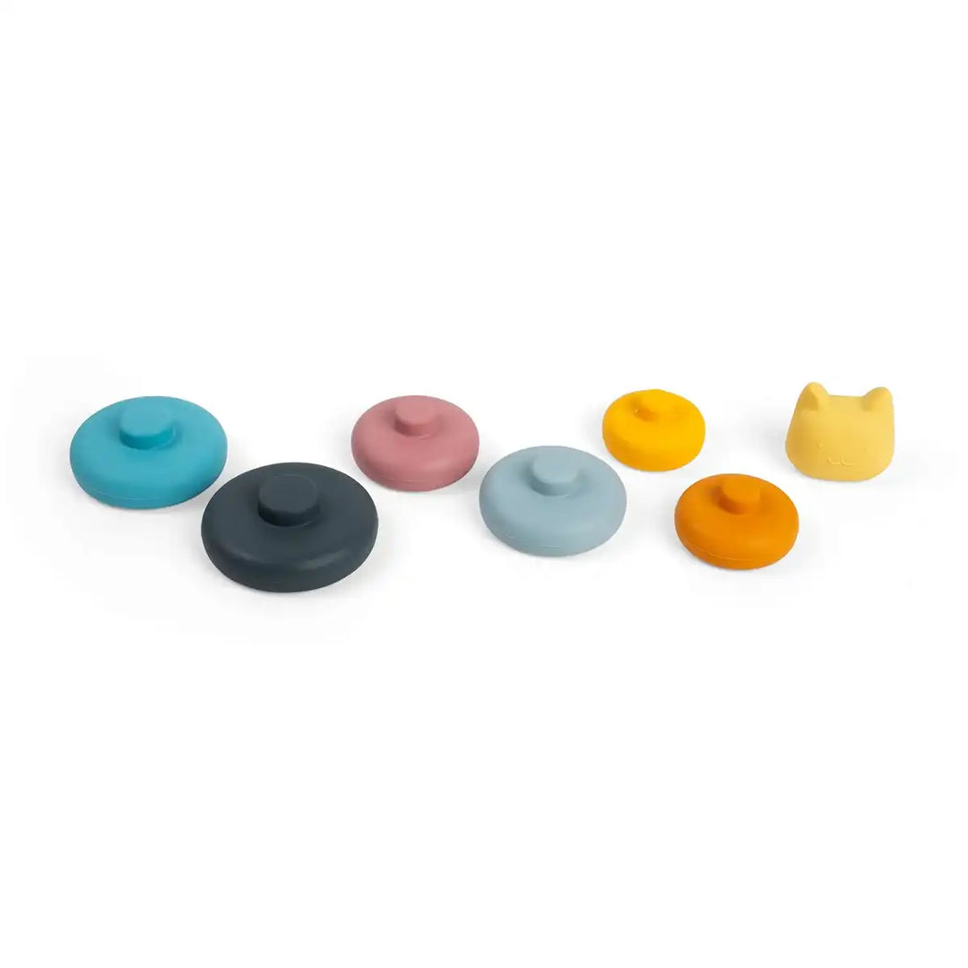 Set of colourful Bigjigs toys silicone stacking shapes with a cat-shaped lid on a white background