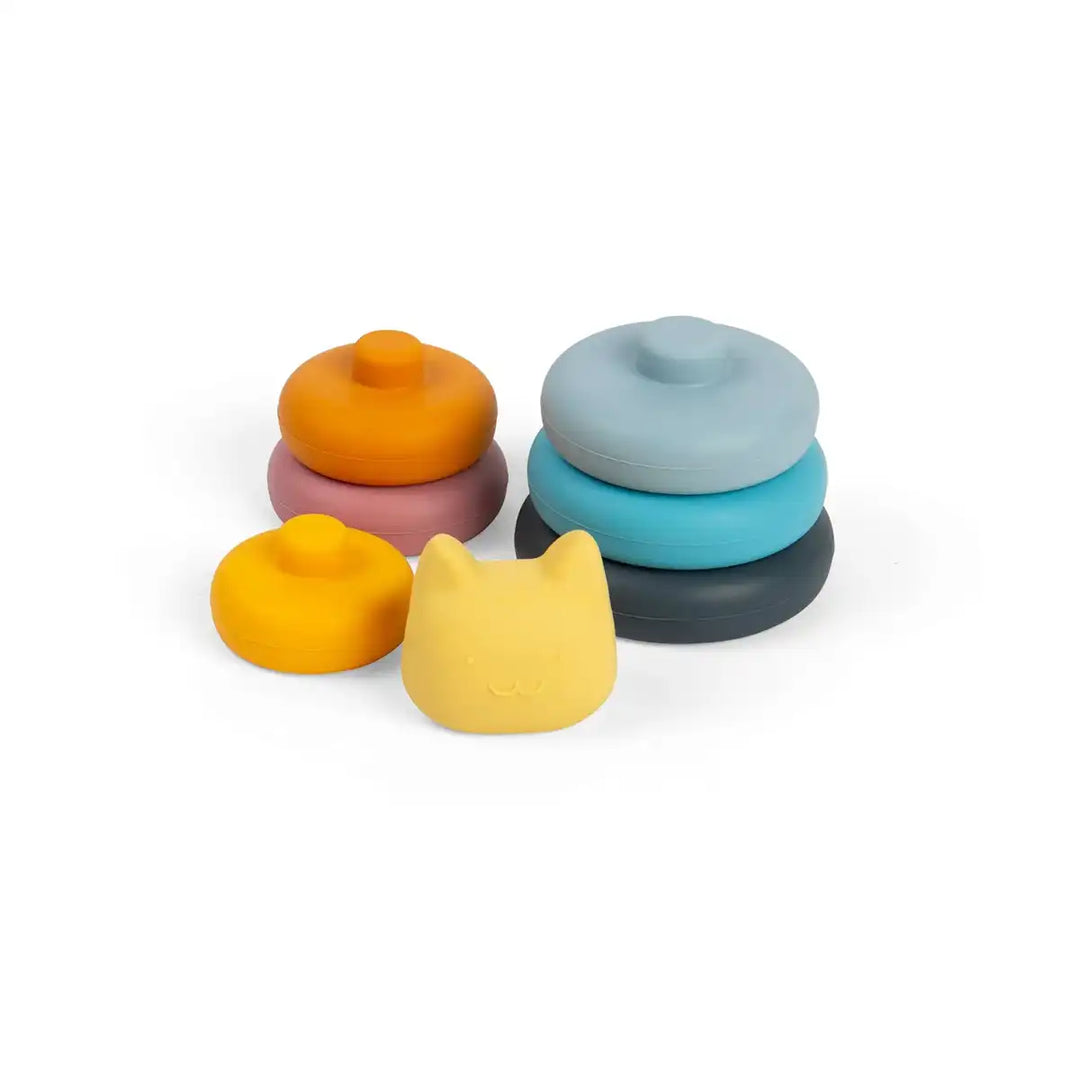 Set of colourful Bigjigs toys silicone stacking shapes with a cat-shaped lid on a white background
