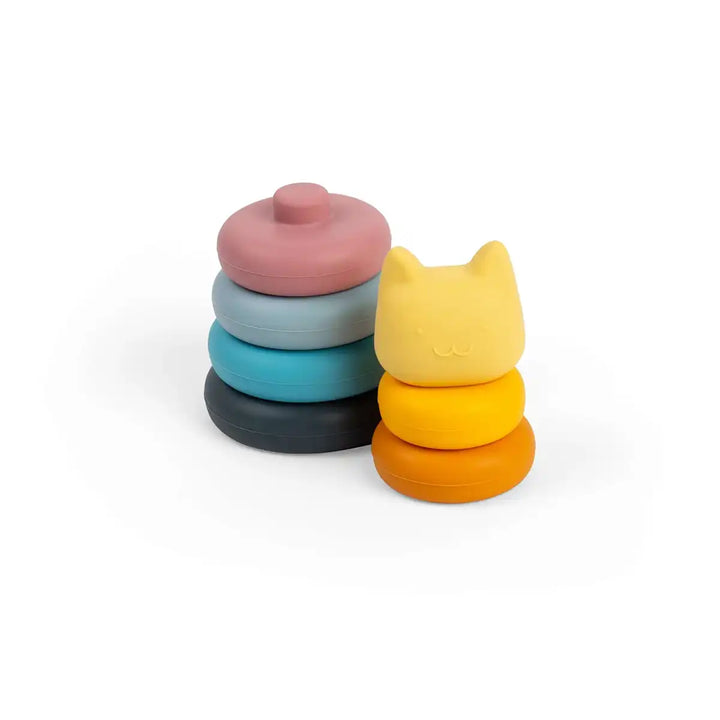 Set of colourful Bigjigs toys silicone stacking shapes with a cat-shaped lid on a white background
