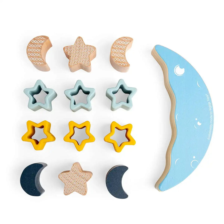 Set of wooden moon and star-shaped blocks on a white background