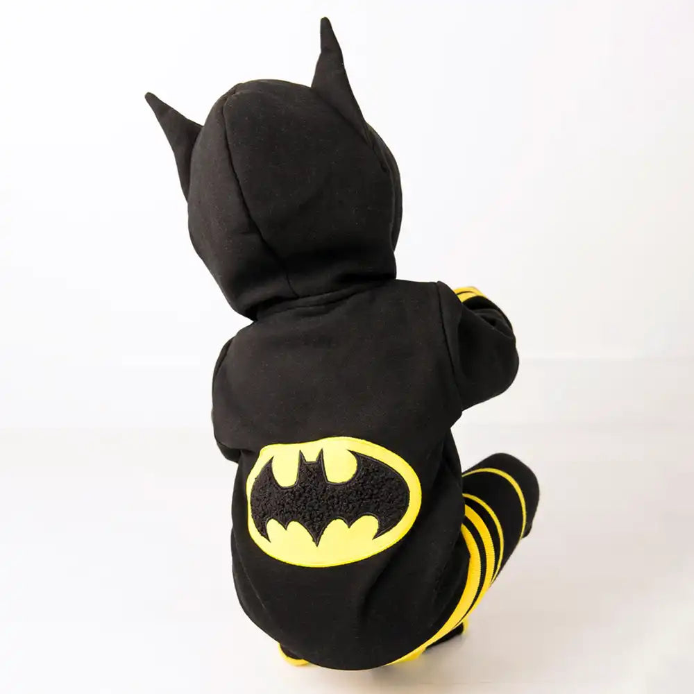 Child wearing a Blade and Rose Batman-themed hoodie with yellow logo on a white background