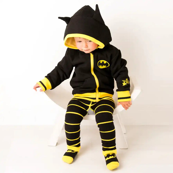 Child wearing a Blade and Rose Batman-themed hoodie and leggings set on a white background