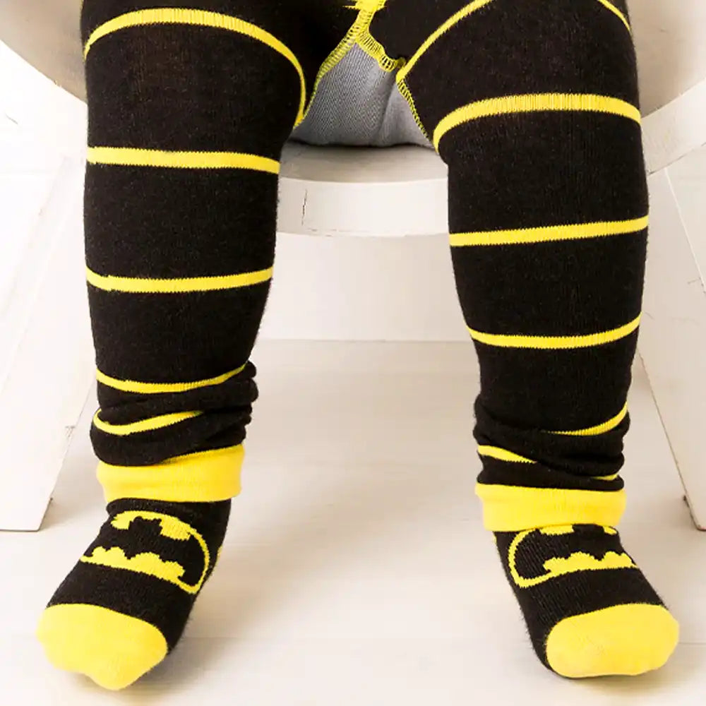 Blade and Rose black and yellow striped socks with Batman logo worn by a child.