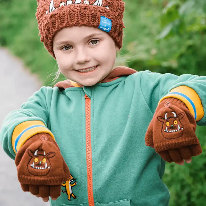 Child wearing brown Blade & Rose Gruffalo hat with matching Gruffalo mittens outdoors