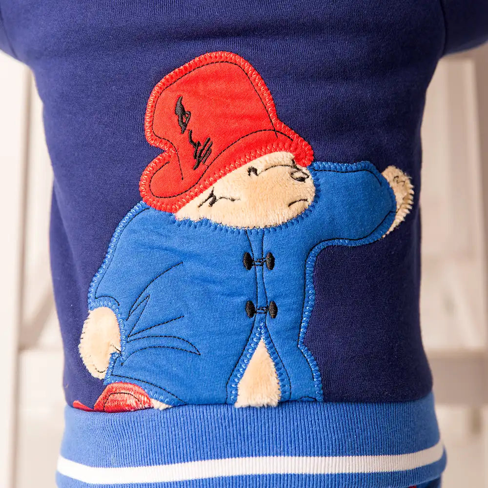 Blade and Rose Paddington Out and About Hoodie navy blue jacket with a Paddington patch wearing a red hat and blue coat.