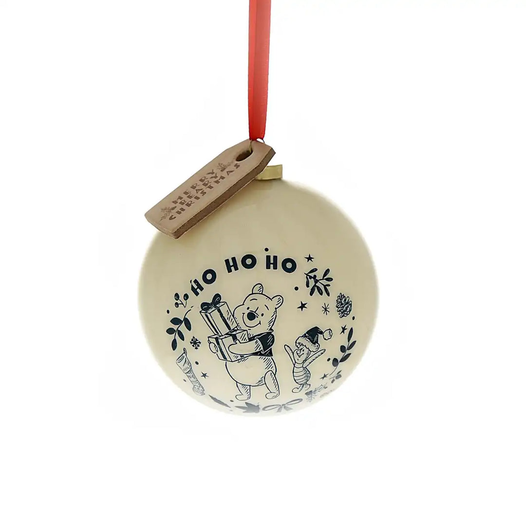 Round Christmas ornament with Winnie the Pooh design and 'Ho Ho Ho' text on a white background.
