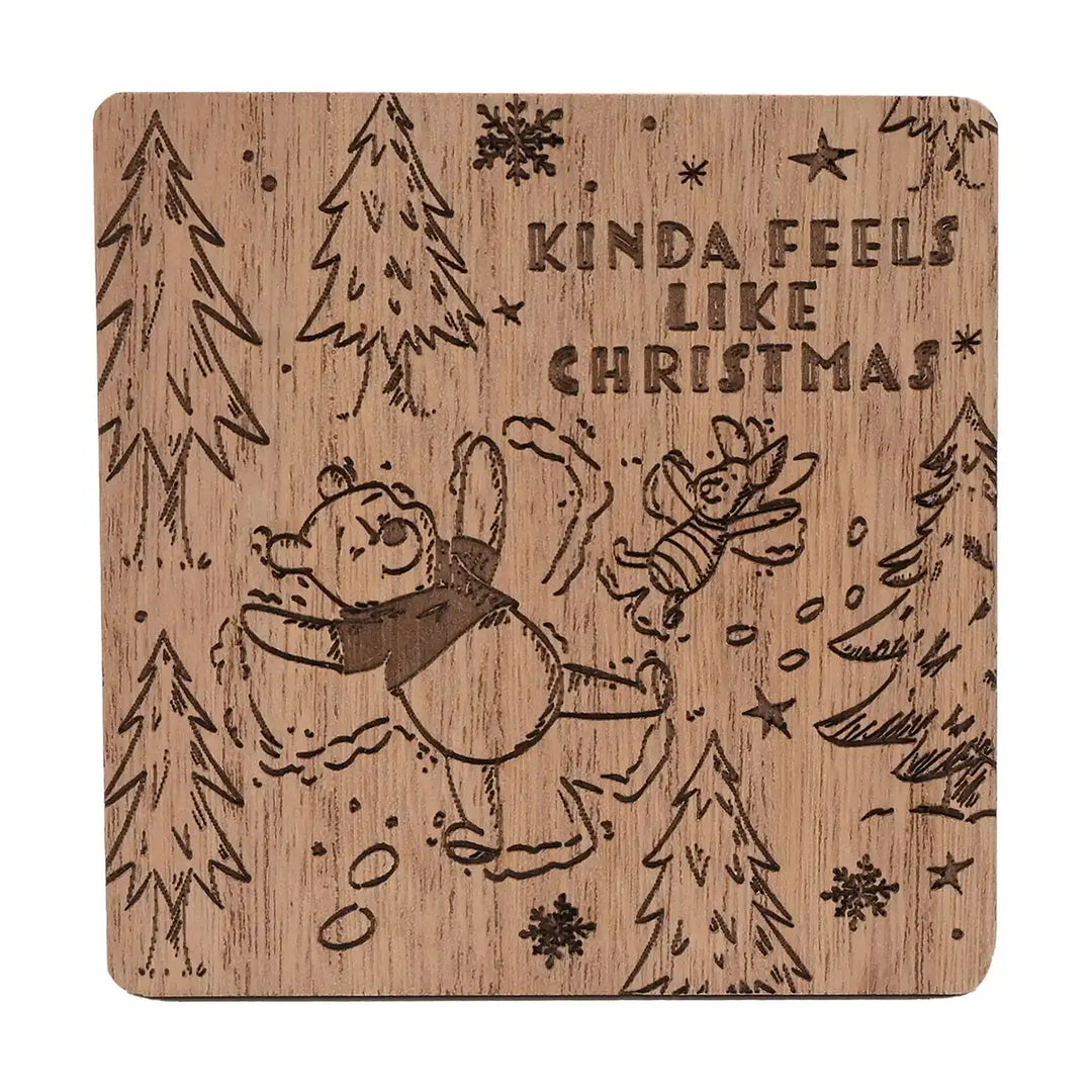 Disney Winnie the Pooh wooden coaster with Christmas-themed Pooh & Piglet design and text 'Kinda Feels Like Christmas' on a white background.