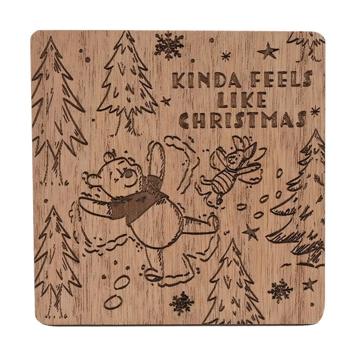 Disney Winnie the Pooh wooden coaster with Christmas-themed Pooh & Piglet design and text 'Kinda Feels Like Christmas' on a white background.