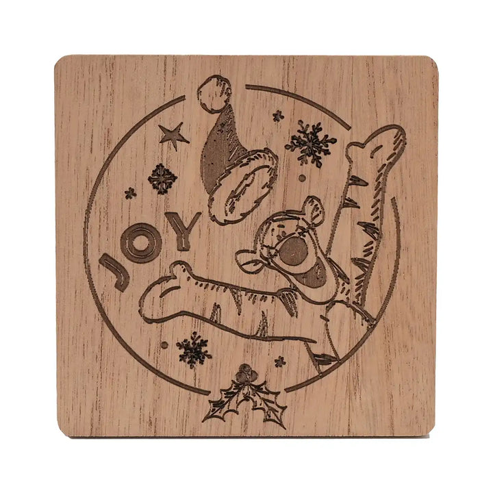 Disney Winnie the Pooh Christmas wooden coaster with Christmas design featuring Tigger and the word 'JOY'.