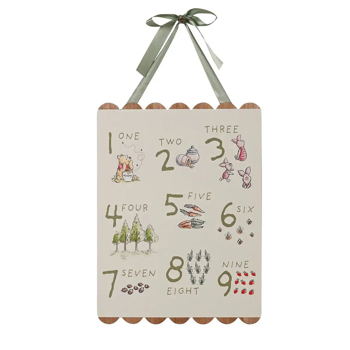 Disney Winnie the Pooh children's educational wooden counting plaque with numbers and illustrations, hanging on a white background.
