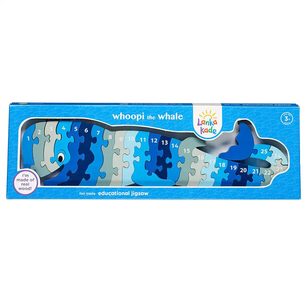 Lanka Kade Whoopi the Whale educational jigsaw puzzle in its blue retail box, showing the numbered whale-shaped puzzle pieces through a clear window.