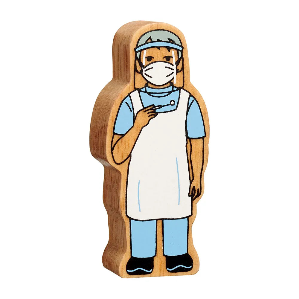 Lanka Kade wooden toy figure of a dentist, shown on a plain white background. The figure has a light brown wood grain body, wearing a white apron, light blue scrub top, blue trousers, black shoes, and a light blue face shield with a white mask.
