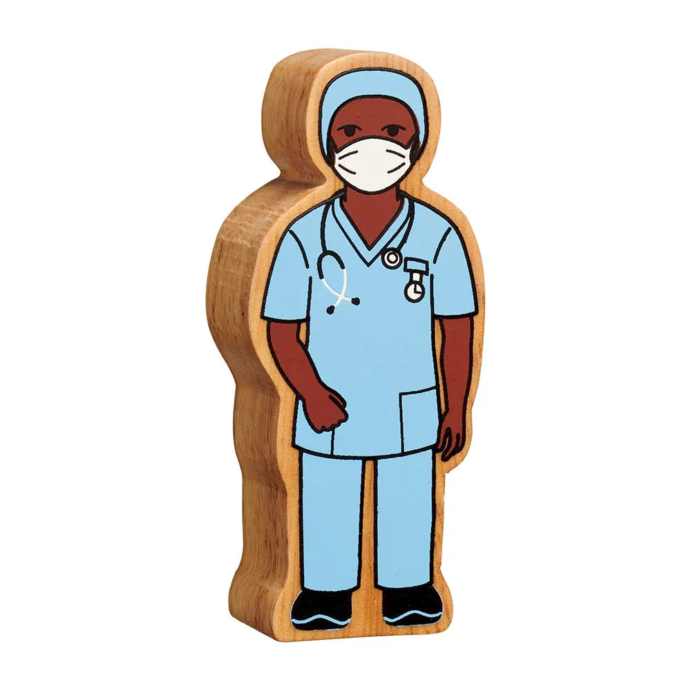 Lanka Kade wooden nurse, featuring a light blue medical uniform, white face mask, dark brown skin, and black shoes, isolated on a white background.