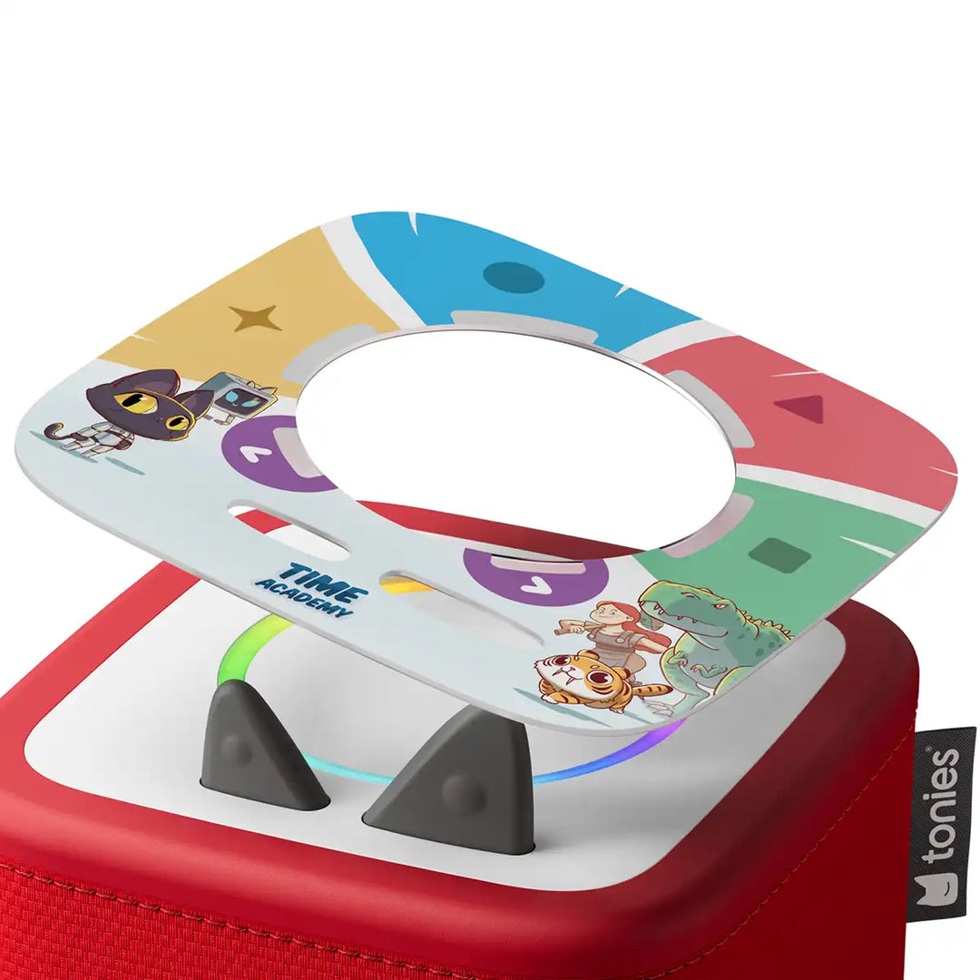 Colourful Tonieplay Time Academy game disc on a red toniebox 2 on a white background