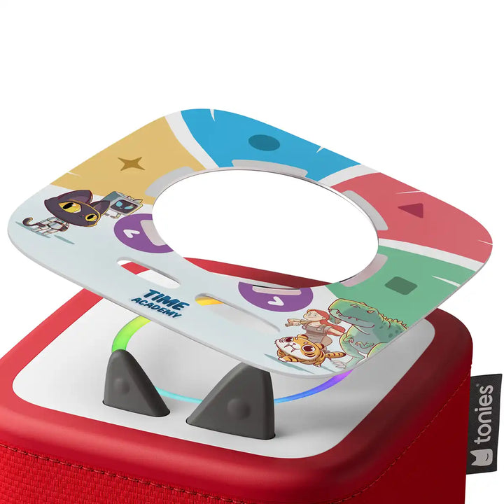 Colourful Tonieplay Time Academy game disc on a red toniebox 2 on a white background