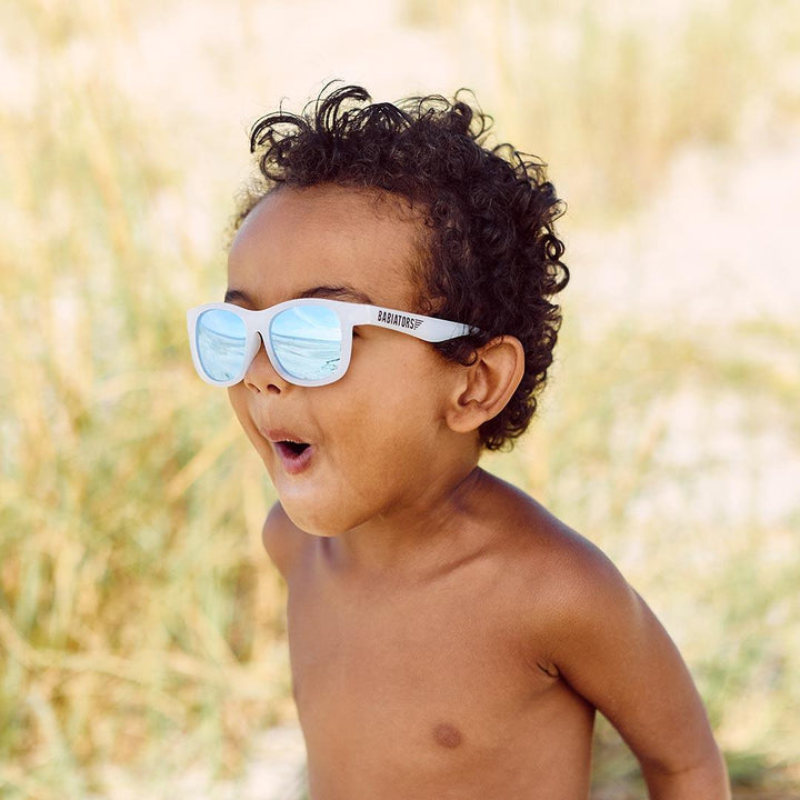 Babiators blue series navigator sunglasses in the ice breaker white being worn boy
