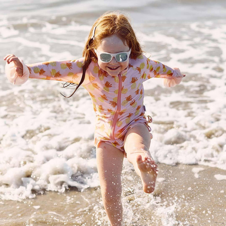 Babiators blue series navigator sunglasses in the ice breaker white being worn girl
