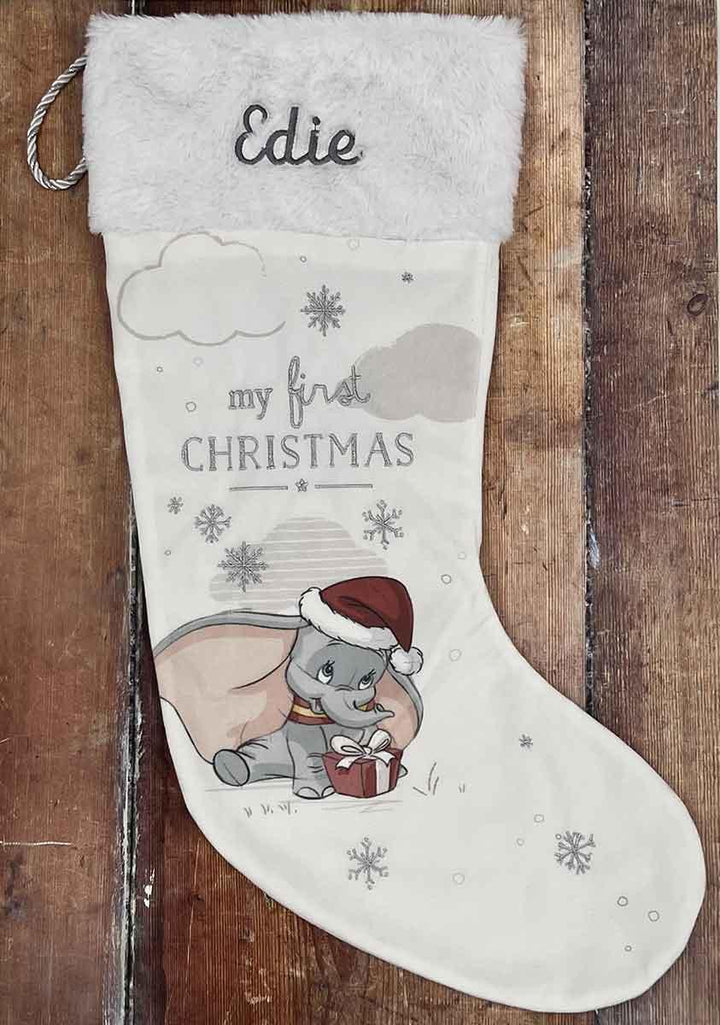 Personalised Dumbo 1st Christmas Stocking Edie on Wooden Background