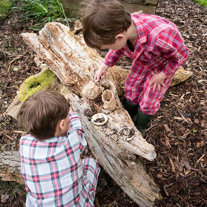 The Den Kit Company Make a Pizza for the Birds Activity Kit Being Used Outside