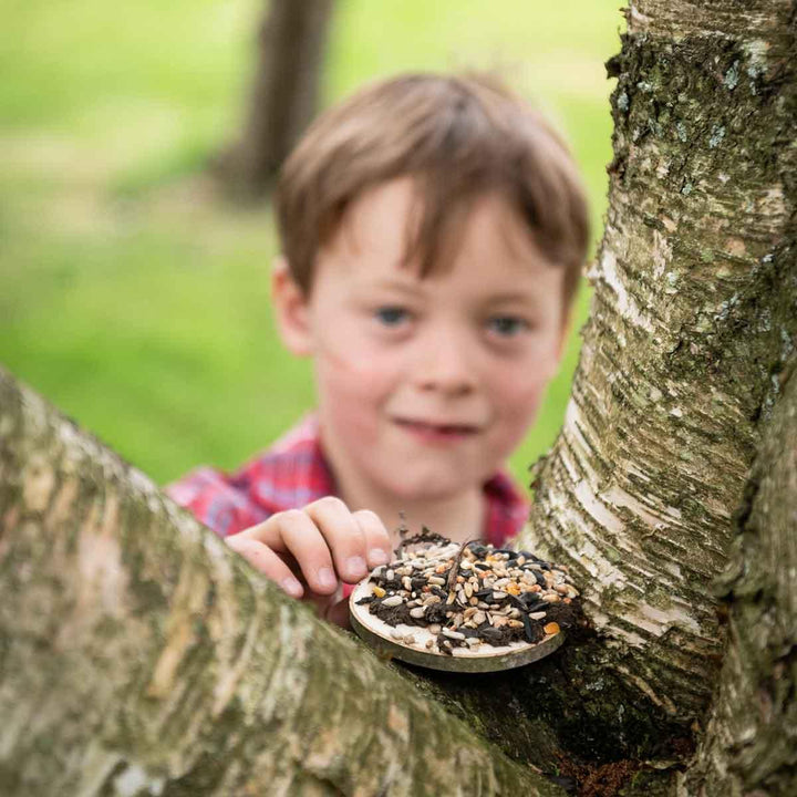 The Den Kit Company Make a Pizza for the Birds Activity Kit Being Used Outside