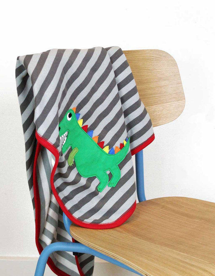 Toby Tiger GOTS Organic Cotton Trex Applique Blanket Hung Over Chair Picture